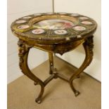 A Vienna style Gilt Gueridon salon table, inset with a porcelain plate to centre of The Duchess of