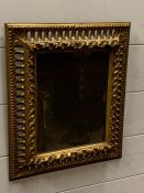 A gilt framed foxed wall mirror (37cm x 32cm)