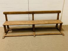 A Victorian pine school pew (H64cm W190cm D63cm)