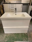 A wash stand with two drawers and sink