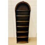 A open bookcase with domed top (H173cm W53cm)