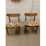 A pair of Mid Century teak dining chairs