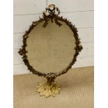 A brass table top ribbon mirror (65cm x 40cm)