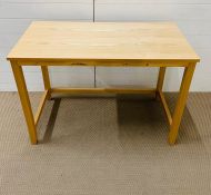 A contemporary pine desk (H75cm W105cm D52cm)