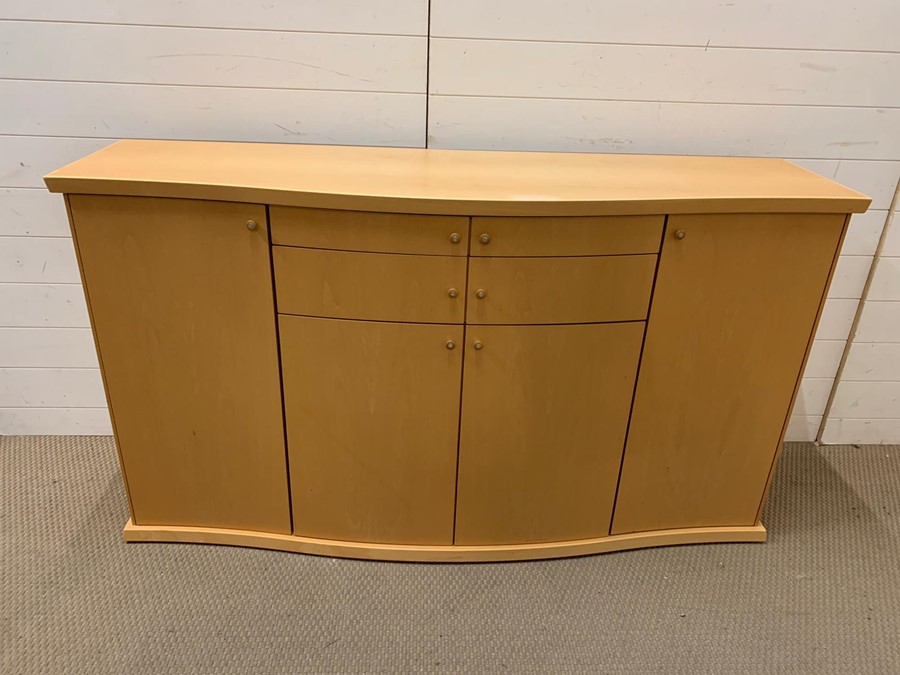 A Skovby sideboard with cupboards to sides and drawers to centre, made in Denmark (H90cm W158cm