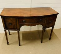 A Bow Front sideboard with arch knee hole centre drawer flanked by deep cupboards to sides( H 90