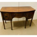 A Bow Front sideboard with arch knee hole centre drawer flanked by deep cupboards to sides( H 90