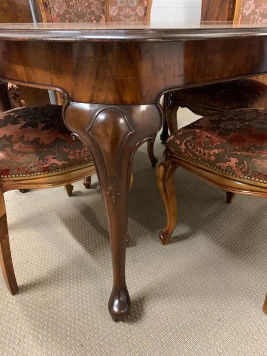 An extending dining table with moulded top on pad feet, two leaves and six upholstered chairs (Table - Image 6 of 9