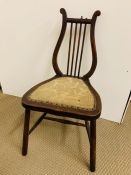 A Hall chair with harp shaped back.
