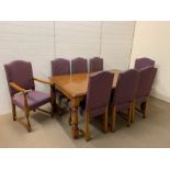 An Stewart Linford burr oak dining suite consisting of table, six chairs and two carvers by