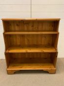 A pine waterfall bookcase (H102cm W95cm D36cm)