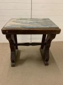 A marble top table on wooden base (H76cm W74cm D50cm)