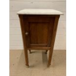 A marble topped pot cupboard (H77cm W40cm D37cm)