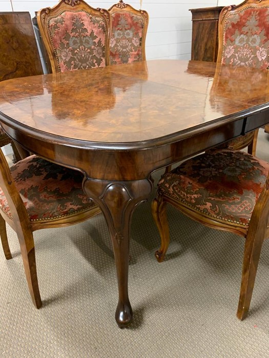 An extending dining table with moulded top on pad feet, two leaves and six upholstered chairs (Table - Image 4 of 9
