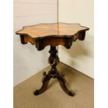 A mahogany tripod table with marquetry to top, brass swags and leaves to base (H79cm Dia65cm)