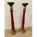 A pair of colourful turned wooden candlesticks (H63cm)