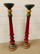 A pair of colourful turned wooden candlesticks (H63cm)