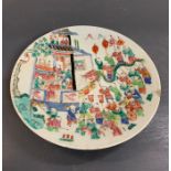 An oriental decorative plate depicting a celebration parade