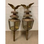 A pair of 19th century brass and copper carriage/buggy candle lamps with eagles finals