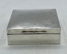 A Silver cigarette box with indistinct hallmarks, 9 x 9 cm sq and 3 cm high.