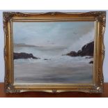 An oil on canvas depicting a seascape, signed and framed.