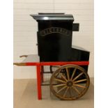 A Jacket Potato oven on cart by Victoria, with hand wash basin and gas cylinder cupboard for outdoor