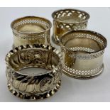 A Selection of four hallmarked silver napkin rings, various makers and hallmarks.