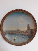 A French terracotta decorative dish with relief depicting Marseille's cathedral from the sea, (35 cm