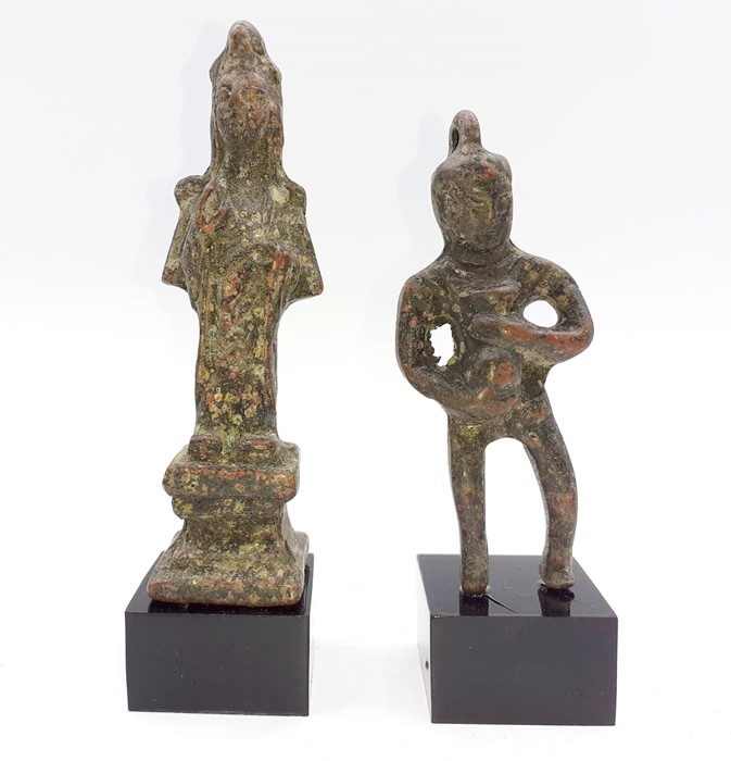 A pair of small Chinese bronze figures on a stand (10cm larger -without stand-). Provenance: From