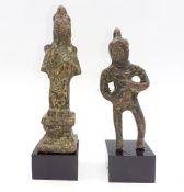 A pair of small Chinese bronze figures on a stand (10cm larger -without stand-). Provenance: From