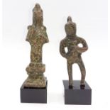 A pair of small Chinese bronze figures on a stand (10cm larger -without stand-). Provenance: From