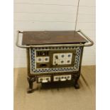 A vintage Charleville French cast iron Stove Range, tiles to sides and front (H76cm W98cm D68cm)