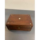 A rosewood box with mother of pearl inlay