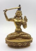 A Tibetan gilt bronze of Manjushri brandishing sword of wisdom, (19 cm high). Provenance: From the