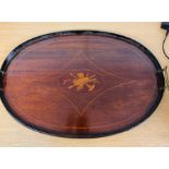 A mahogany inlaid butler tray