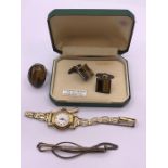 A small selection of jewellery, a rolled gold watch, 9ct gold on silver Gents cuff links, A Tigers