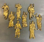 A collection of antique brass Chinese warrior figures, wall hanging