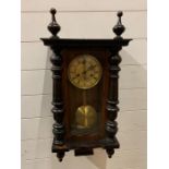 A mahogany in case wall clock