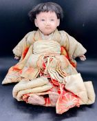 A Japanese doll with ceramic head, hands and legs, probably early 20th Century. AF