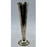A silver vase, hallmarked for London 1907