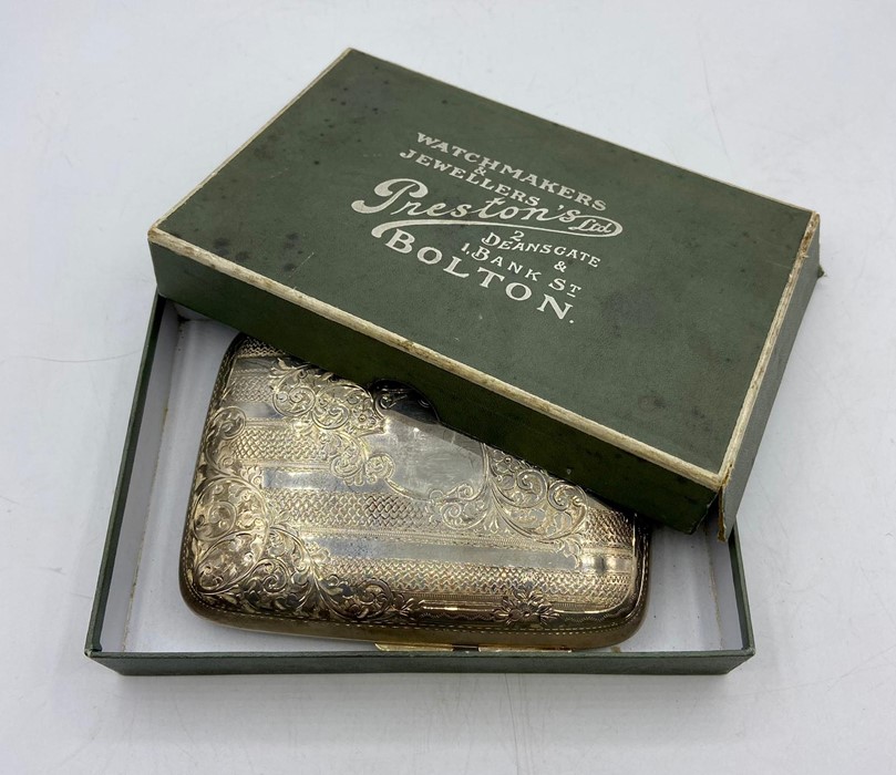 An Ornate silver cigar case, with foliate design and a blank cartouche, by Jospeh Gloster Ltd ,