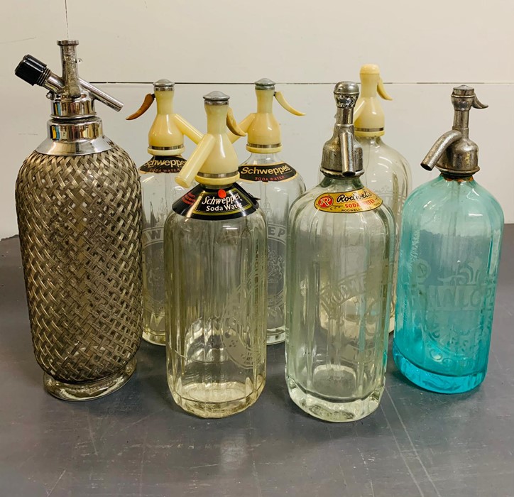 Seven vintage soda siphons