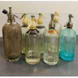 Seven vintage soda siphons