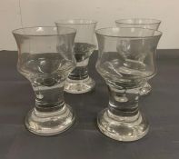 Four large goblet style glasses on steams