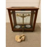 An Oak cased set of scientific scales by L.Oertling Ltd.