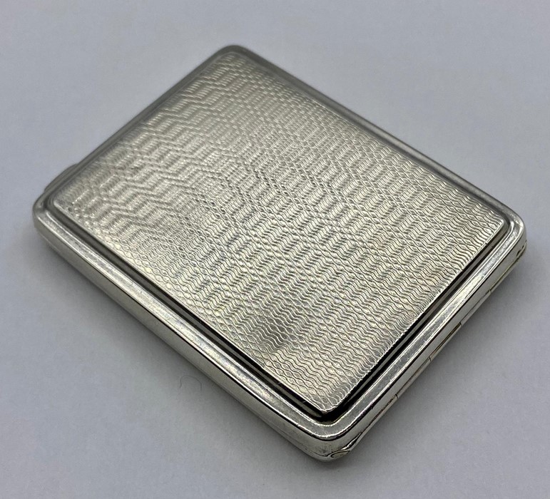 A Machine tooled silver card case Adie Brothers Ltd, hallmarked Birmingham 1928.