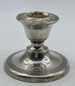 A Silver squat candlestick by James Deakin & Sons Chester 1913, 6 cm high.