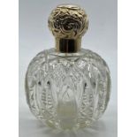 A Silver topped scent bottle, indistinct hallmark possibly Birmingham 1876.