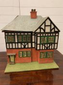 A vintage wooden dolls house