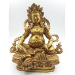 A Tibetan gilt bronze of god of wealth Jambhala, (20.5 cm high). Provenance: From the Sidhu Family